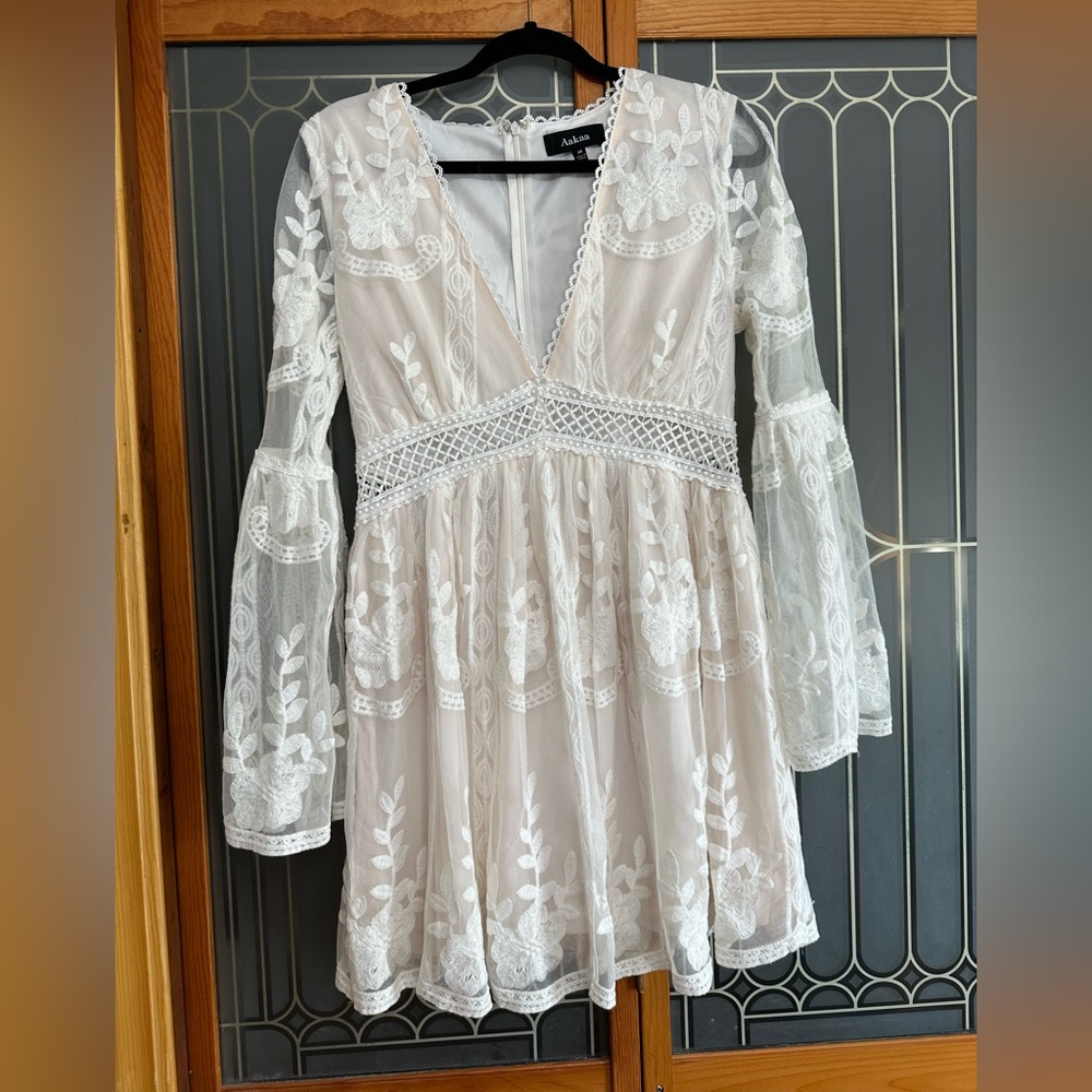 Aaka white lace boutique dress| bell sleeves | deep v neck